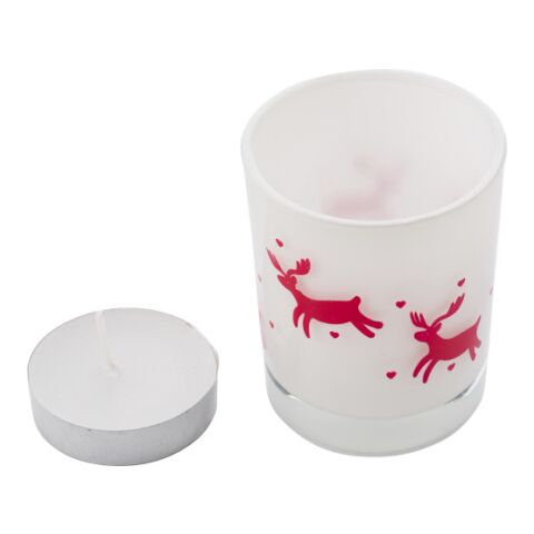 Vaso de cristal con vela y decorado navideño.