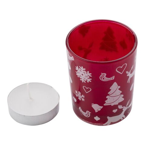 Vaso de cristal con vela y decorado navideño.